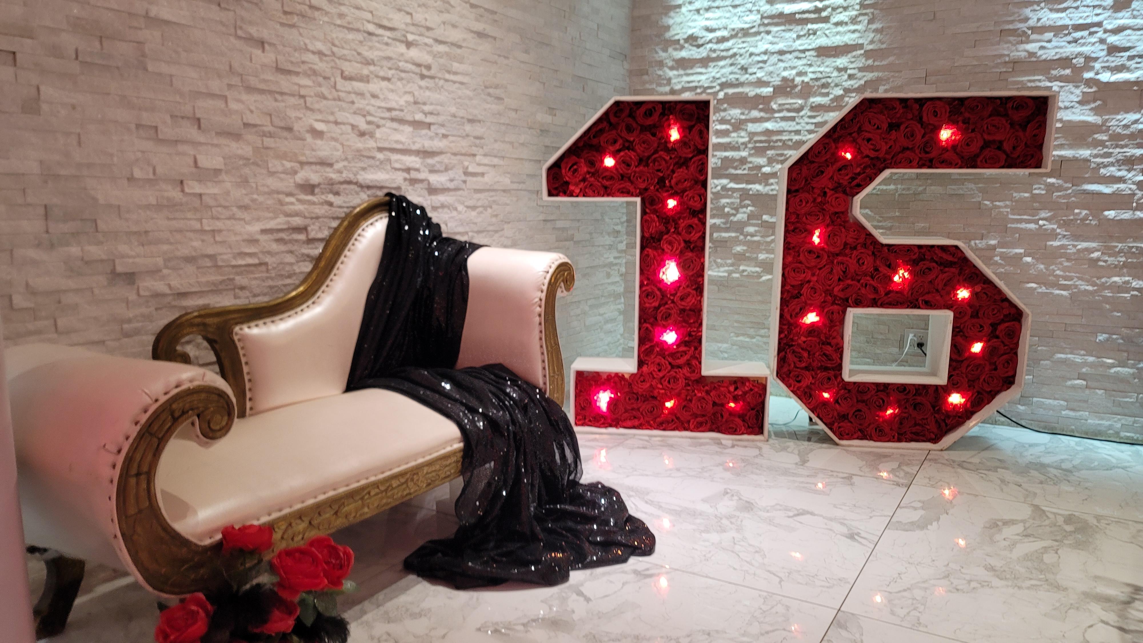 sweet 16 marquee numbers and white leather settee