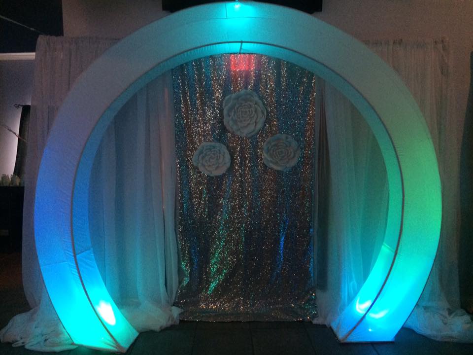illuminated arch and silver glitter photo backdrop