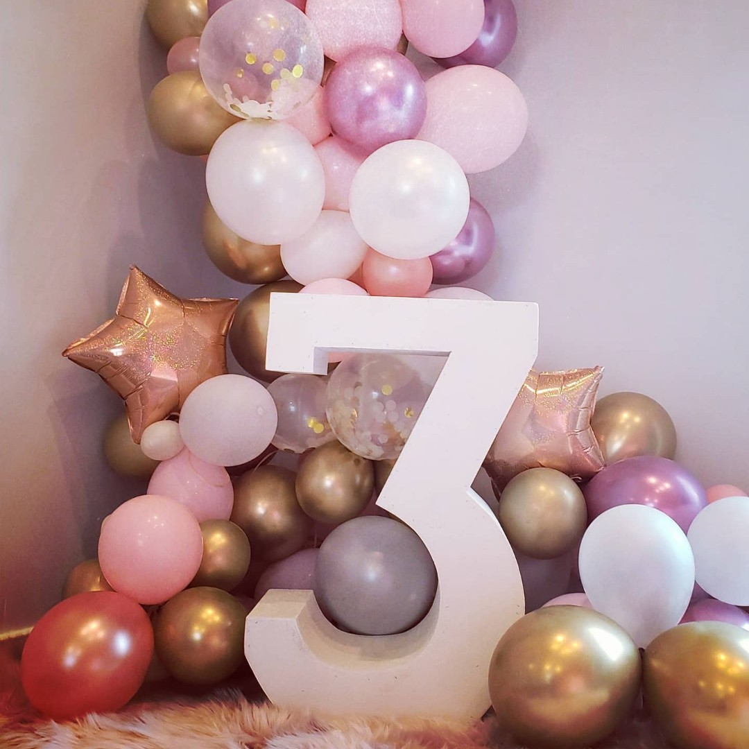 pink and gold balloon decor for third birthday
