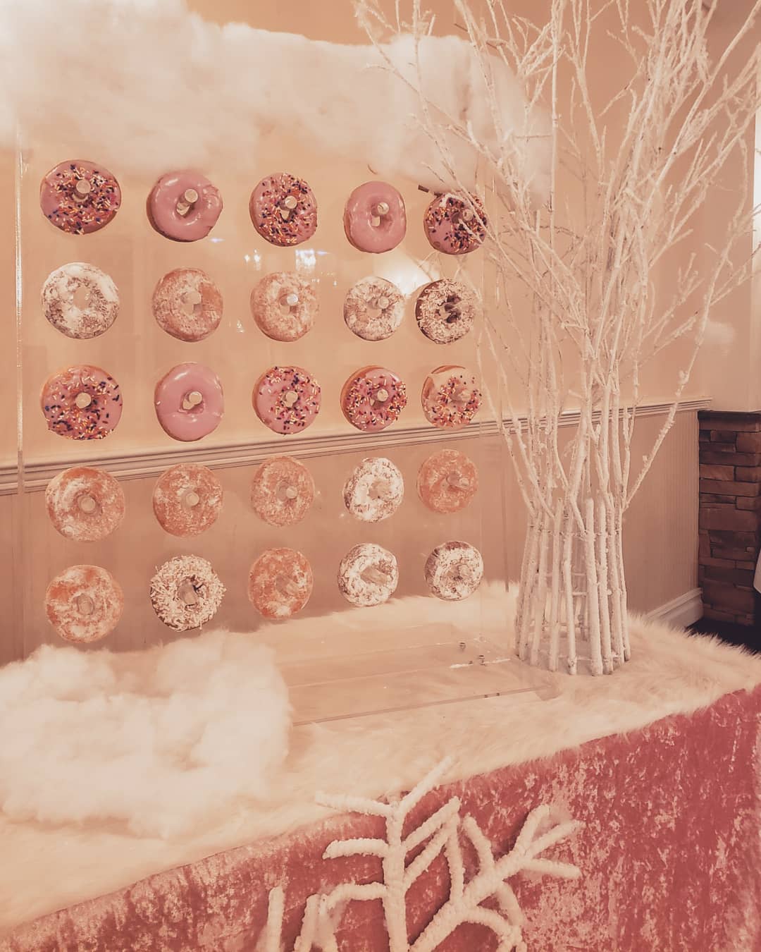 pink donut wall at party